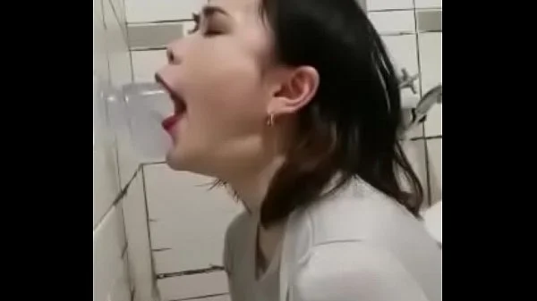 Asian deepthroating a dildo